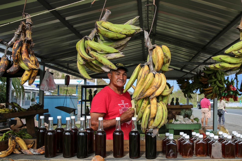 René “Papo” Cruz looks out from his fruit and vegetable stand in Hatillo, Puerto Rico, on Oct. 1