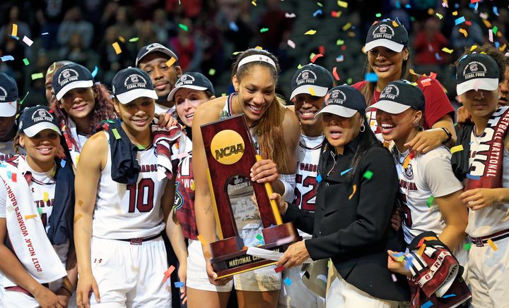 The University of South Carolina women's basketball team holds up the NCAA trophy after beating Mississippi State on April 2.