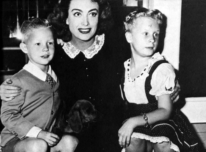 <p>(From left to right): Christopher, Joan, and Christina Crawford</p>