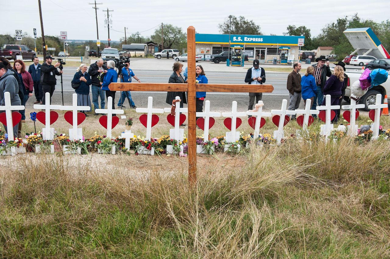 The crosses, erected across the street from the church, have become a meeting ground for mourners.