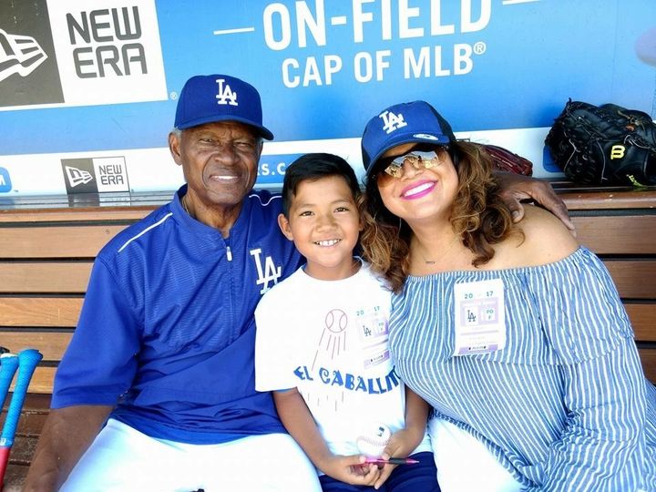 Famed LA Dodger, Manny Mota, alongside Sonia Smith-Kang and son