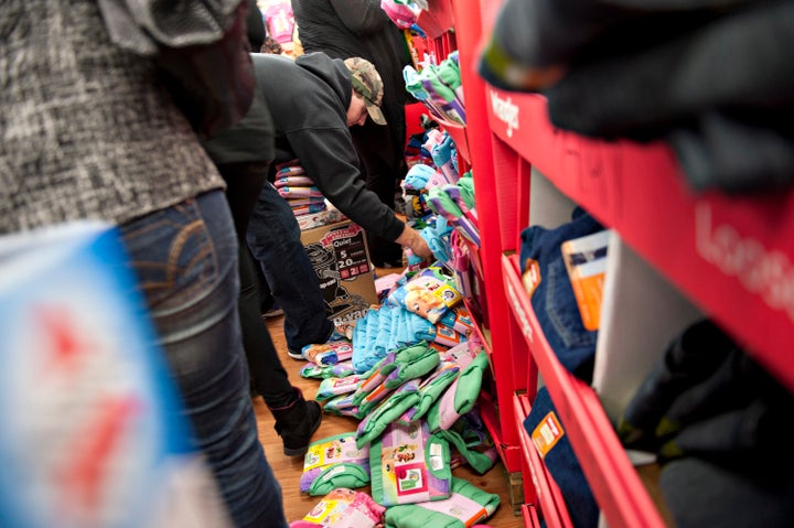 People rifle through a bin of Black Friday-priced children's pajamas at a Walmart store in Ohio in 2011. 