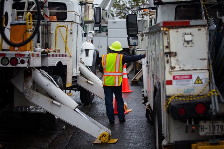 PREPA workers repair damage from Hurricane Maria in Canvanas, Puerto Rico, on Oct. 10.