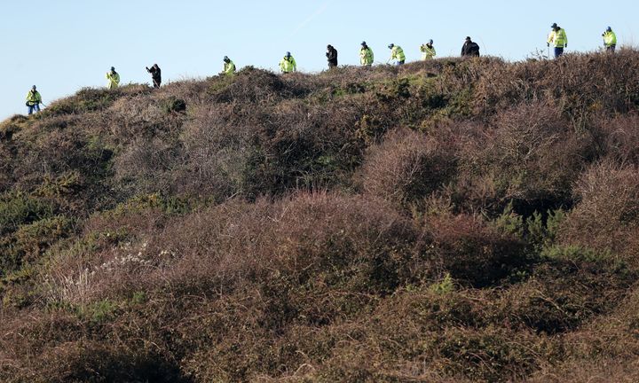 Police search open space above the coast near Swanage