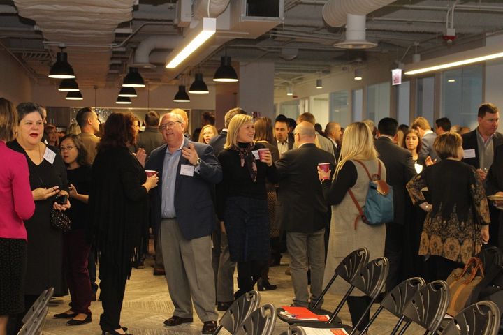 <p>Chicago 2.0 Forum guests chat before the presentation begins.</p>