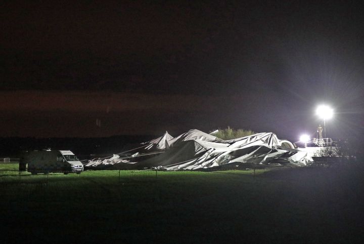 The remains of the Airlander 10, the world's largest aircraft, lies on the ground at Cardington airfield in Bedfordshire, as the aircraft, came loose from its moorings causing its hull to rip and deflate.