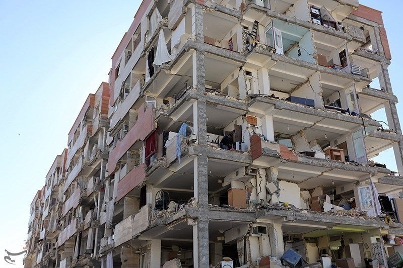 Damaged apartment block of <a rel="nofollow" href="https://en.wikipedia.org/wiki/Construction_industry_of_Iran#Mehr_Housing_S