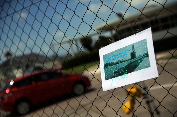 A card for the crew of the missing submarine hangs on a fence at the Argentine Naval Base it sailed from 