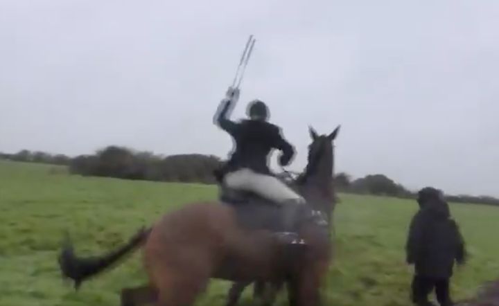 Police are appealing for witnesses to come forward after a horse rider was filmed striking a hunt saboteur with a riding crop.