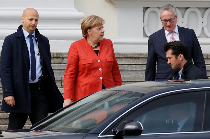 German Chancellor Angela Merkel leaves a meeting with President Frank-Walter Steinmeier after coalition government talks