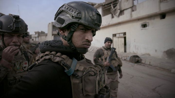 Sergeant Amjad Al-Rakabi on patrol in West Mosul