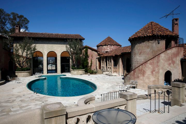 The 8-acre property features panoramic views and Roman villa-style buildings.