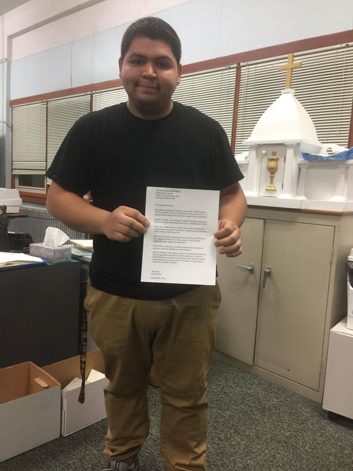 Jose Ramon stands with a letter addressed to Senator Rob Portman requesting clarity on his DACA stance, as well as his v