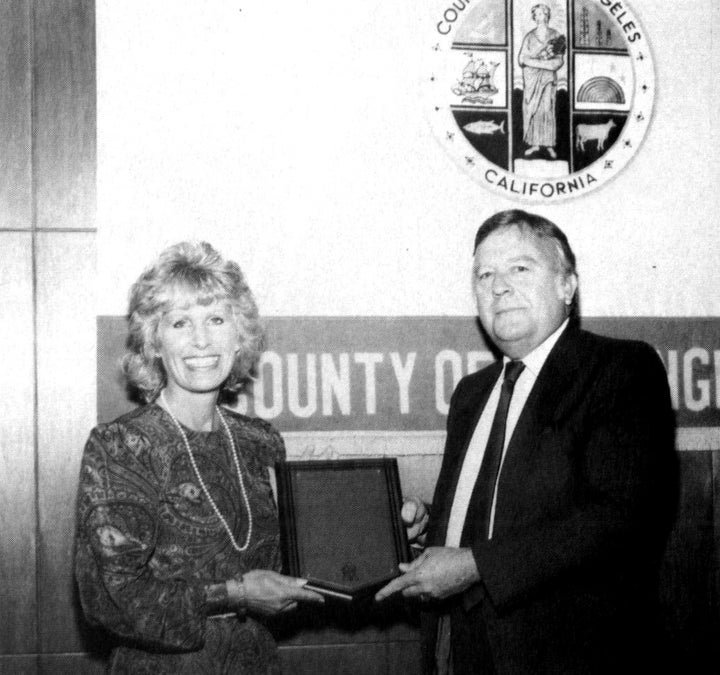 <p>Christina receiving an award for three years of service as Los Angeles County Commissioner for Children's Services</p>