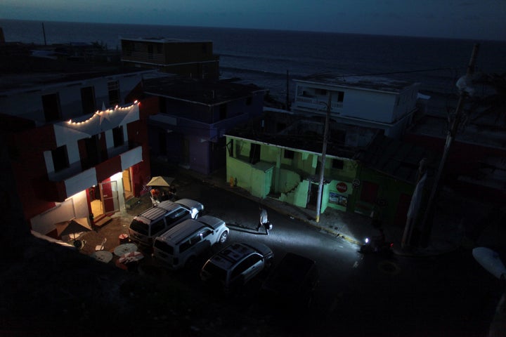 In San Juan, a generator lights up a house on an otherwise dark block on Oct. 26, 2017.