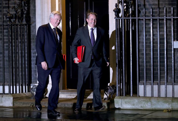 Brexit Secretary David Davis and Liam Fox leave the meeting.