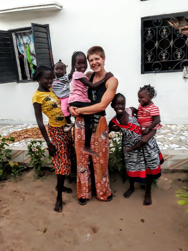 Elise with kids in her host community in Senegal. 