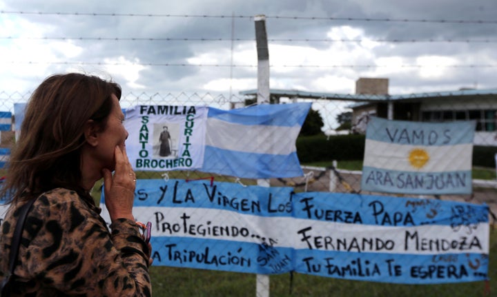 Signs in support of the 44 crew members of the missing submarine at the Argentine Naval Base where the craft sailed from, five days ago