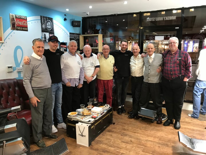 Staff at Luke's Barbershop with The Geezers.