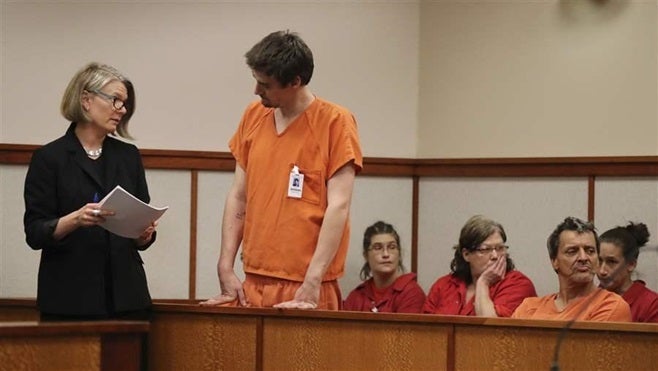 A court-appointed “lawyer of the day” explains a legal implication to a person charged with a crime in Portland, Maine. Incre