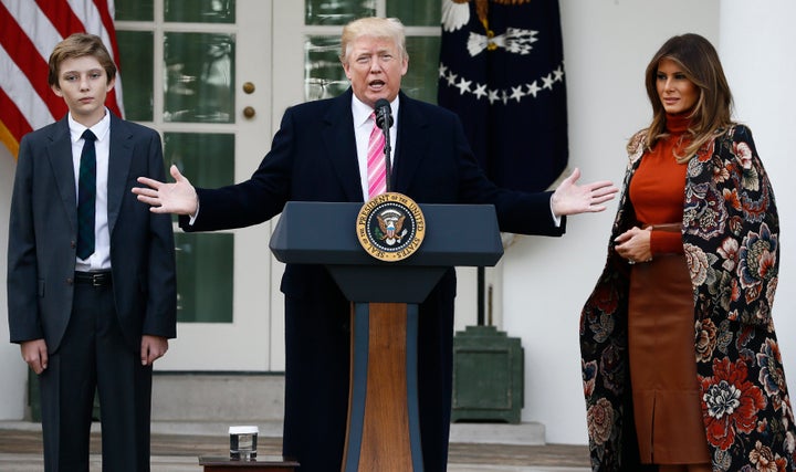 Donald Trump speaks as his son Barron and first lady Melania Trump listen during the 70th National Thanksgiving turkey pardoning ceremony in the Rose Garden of the White House on November 21, 2017.