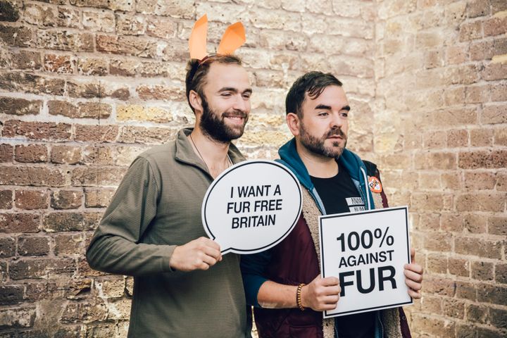 Attendees try the signs at the Lush x HSI event highlighting mislabelled 'faux' fur on the highstreet.