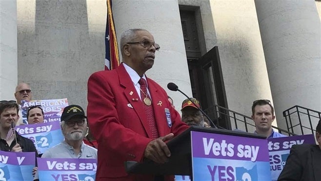 Tuskegee Airman Don Elder speaks out in favor of a ballot measure to curtail state spending on medications at the Ohio Statehouse in Columbus in September. The measure, and another like it in California, was defeated, but advocates say they plan to try again in South Dakota and Washington, D.C.