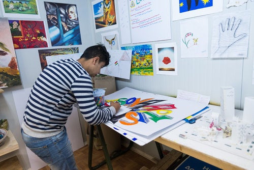 <p><em>A member of the Youth Empowerment Space community creates art for the Ritsona Kingdom Journal </em></p>