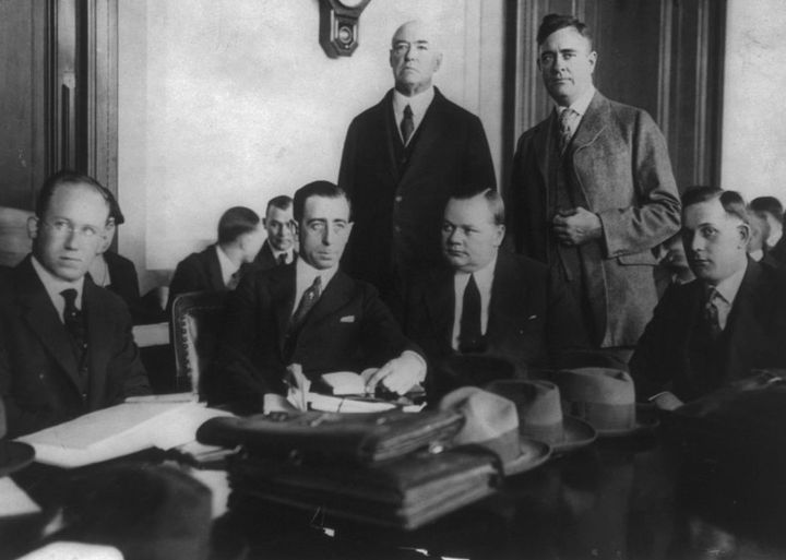 Roscoe “Fatty” Arbuckle seated third from the left circa 1921 at his first trial on rape and manslaughter charges.