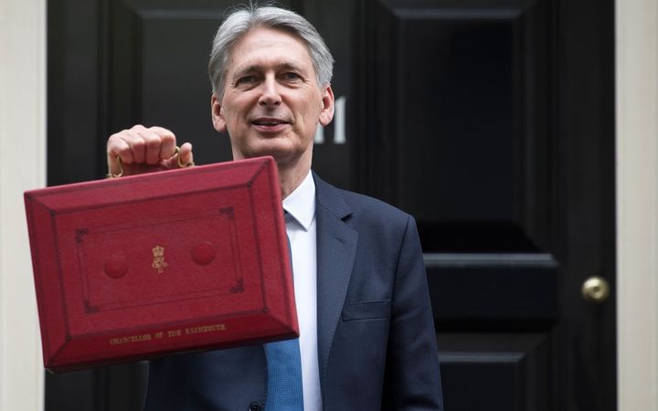 Philip Hammond poses for the cameras in Downing St ahead of the Budget