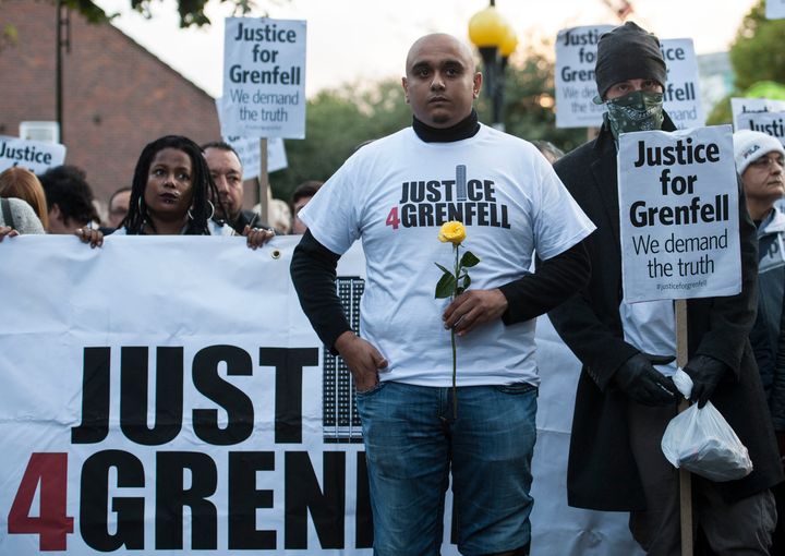 People take part in a silent march for the victims of Grenfell Tower