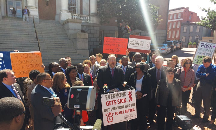 <p>Delegate Luke Clippinger, co-sponsor of the Healthy Working Families Act, with advocates.</p>