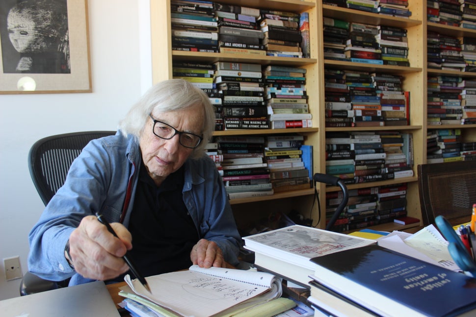 Robert Jay Lifton jots down notes in the office of his Upper West Side apartment on a sunny October morning. 