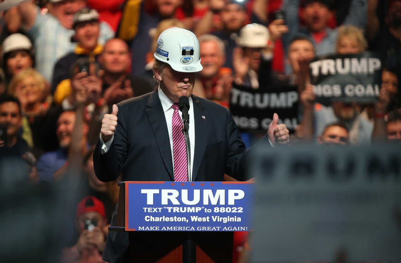 President Donald Trump posing with a hard hat in coal country during the 2016 presidential campaign.