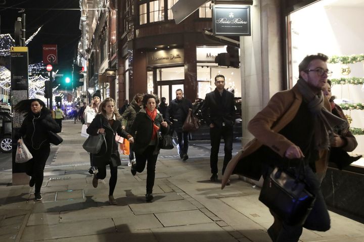 Panicked shoppers run along Oxford Street on Friday night