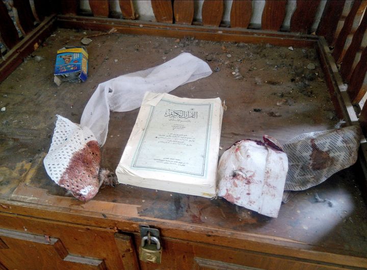 A Quran and remnants of personal belongings of victims, seen at the mosque