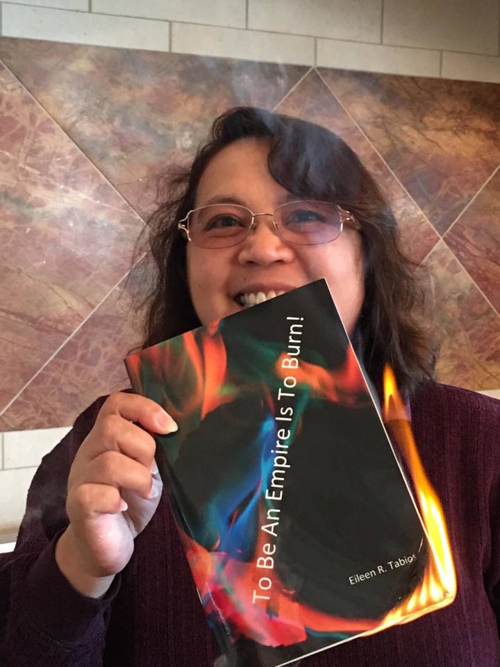 Poet Eileen Tabios with her poetry chapbook ‘To Be An Empire Is To Burn!’ — which she set on fire to reflect its title. ww2.kqed.org