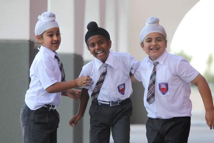 <p>It is customary for children from Sikh communities to wear a turban to school</p>