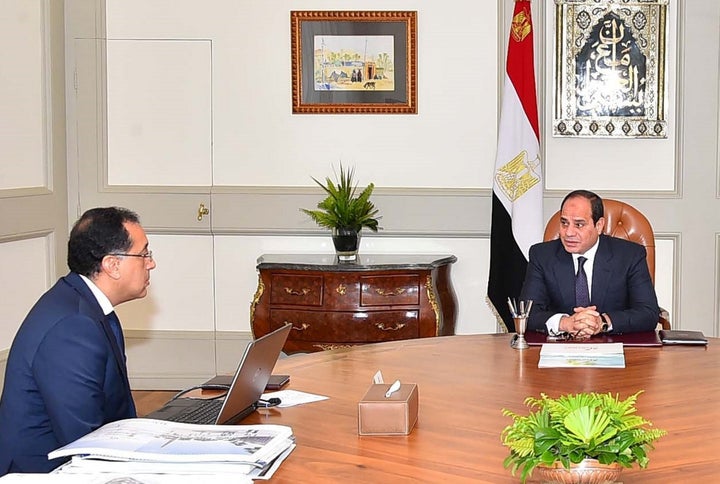 Egyptian President Abdel Fattah al-Sisi meets with Housing Minister Mustafa Madbuly, who serves as interim prime minister, to