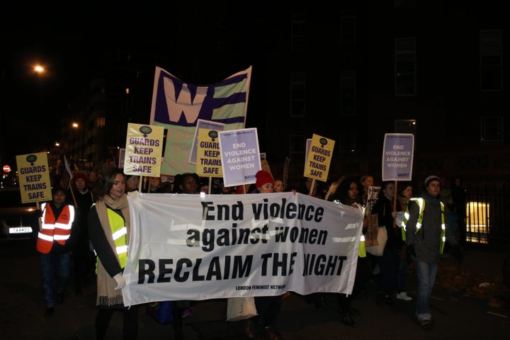 The front banner read: 'End violence against women'