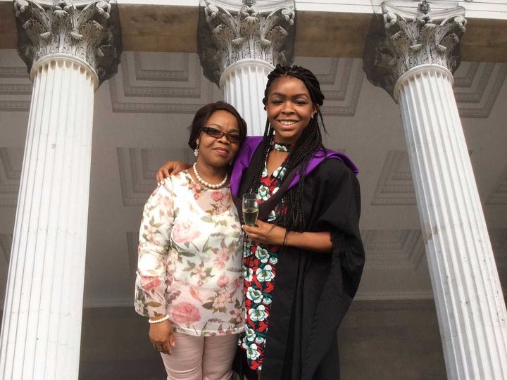 My mum and I posing together after the graduation ceremony