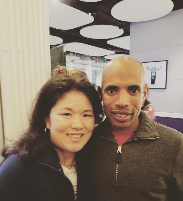 <p><em>Kristin Meekhof with Meb Keflezighi</em></p>
