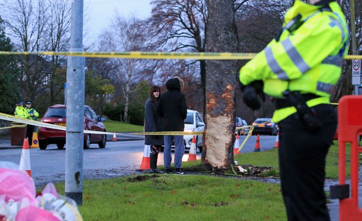 A woman at the scene of the crash in Stonegate Road, Leeds