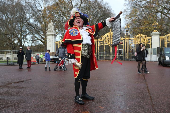 Town Crier Tony Appleton outside Green Park in central London near Buckingham Palace after it was announced that Prince Harry and Meghan Markle are engaged