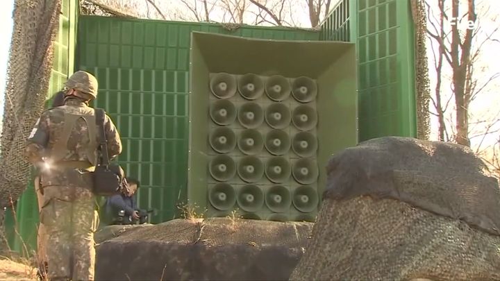 South Korea has reportedly been broadcasting updates on the condition of a defecting North Korean soldier through loudspeakers so its northern rival can hear.