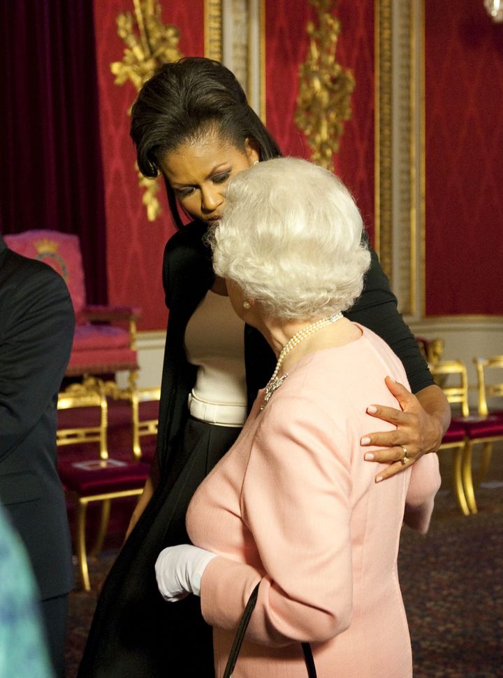 Cosy: The Queen famously embraced then First Lady Michelle Obama 