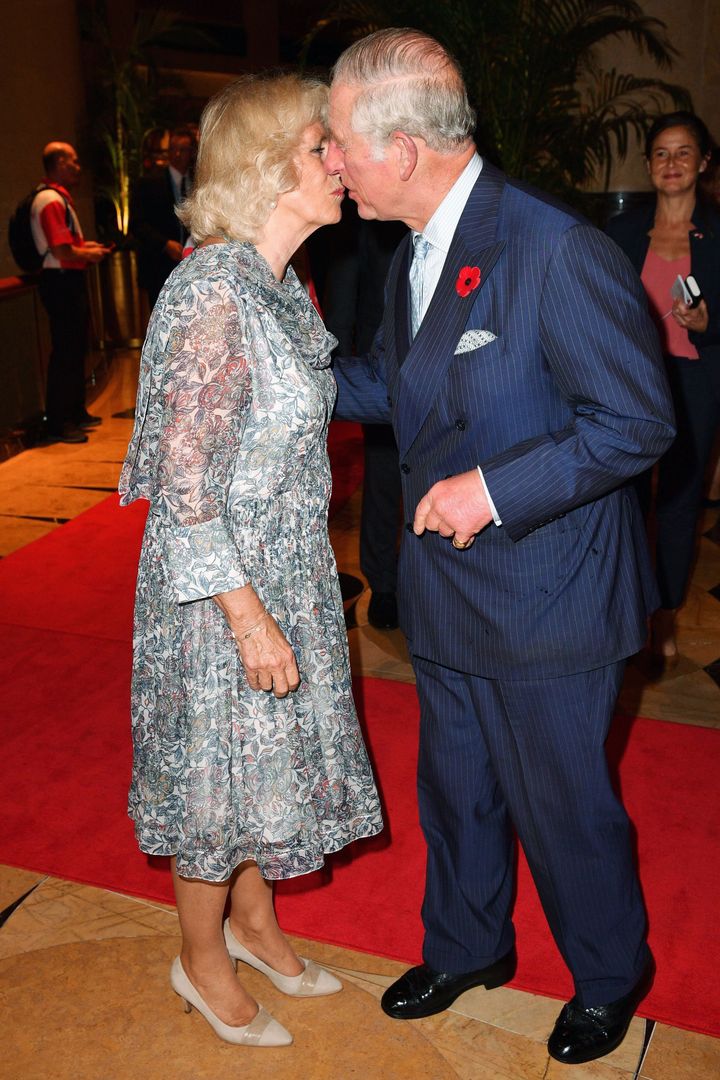 Give us a kiss: Prince Charles and Camilla pictured in Singapore in October 