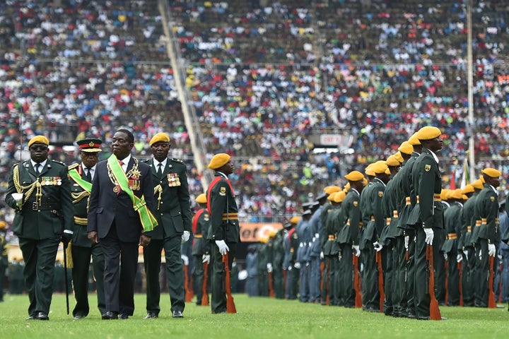Zimbabwe's new interim president, Emmerson Mnangagwa, performs his first inspection of the Guard of Honour after he is offici