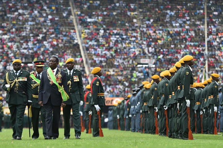 Zimbabwe's new interim president, Emmerson Mnangagwa, performs his first inspection of the Guard of Honour after he is officially sworn in on Nov. 24, 2017.