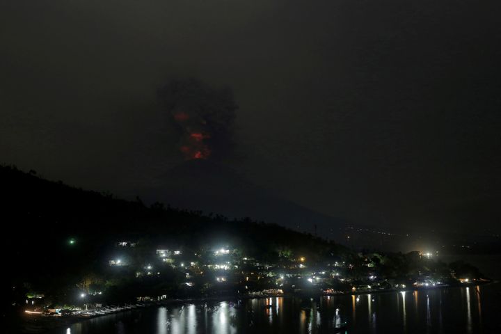 The glowing light of hot lava reflected on volcanic ash on Mount Agung on Monday